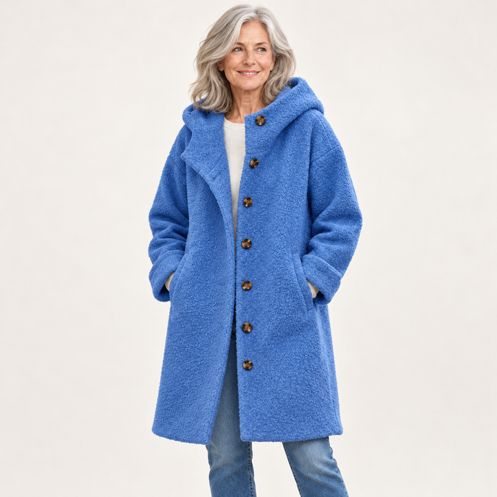 Blue hooded coat on mature model
